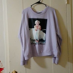 I'm selling a lavender sweater with a picture of Marilyn Monroe in the front